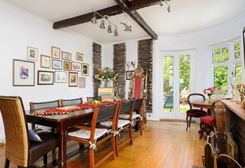 Light and spacious, the dining area provides ample room for guests to gather together at mealtime. 