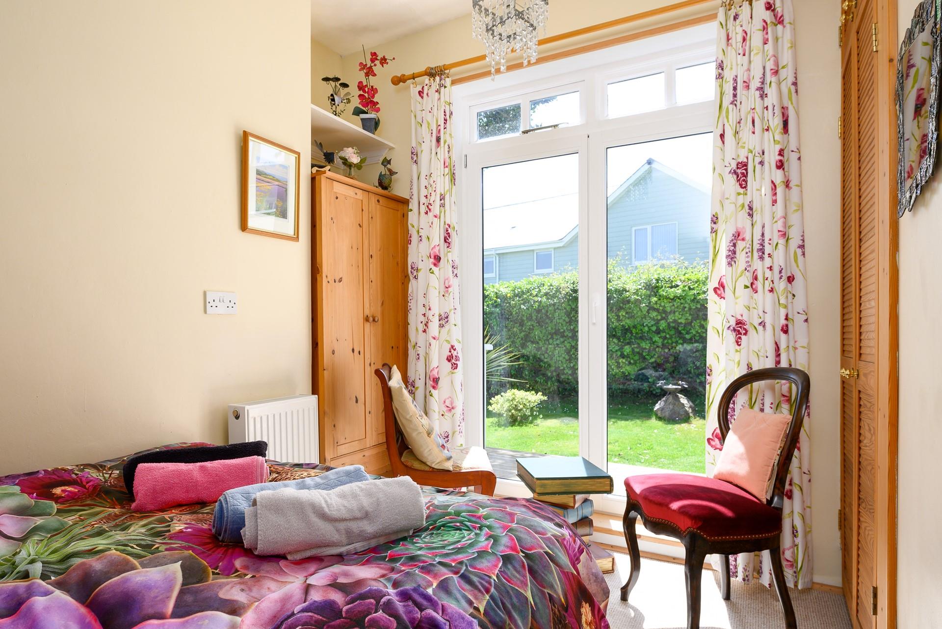 With large patio doors in bedroom 2, why not throw open the patio doors and enjoy a morning cuppa in bed, with the gentle breeze drifting through?