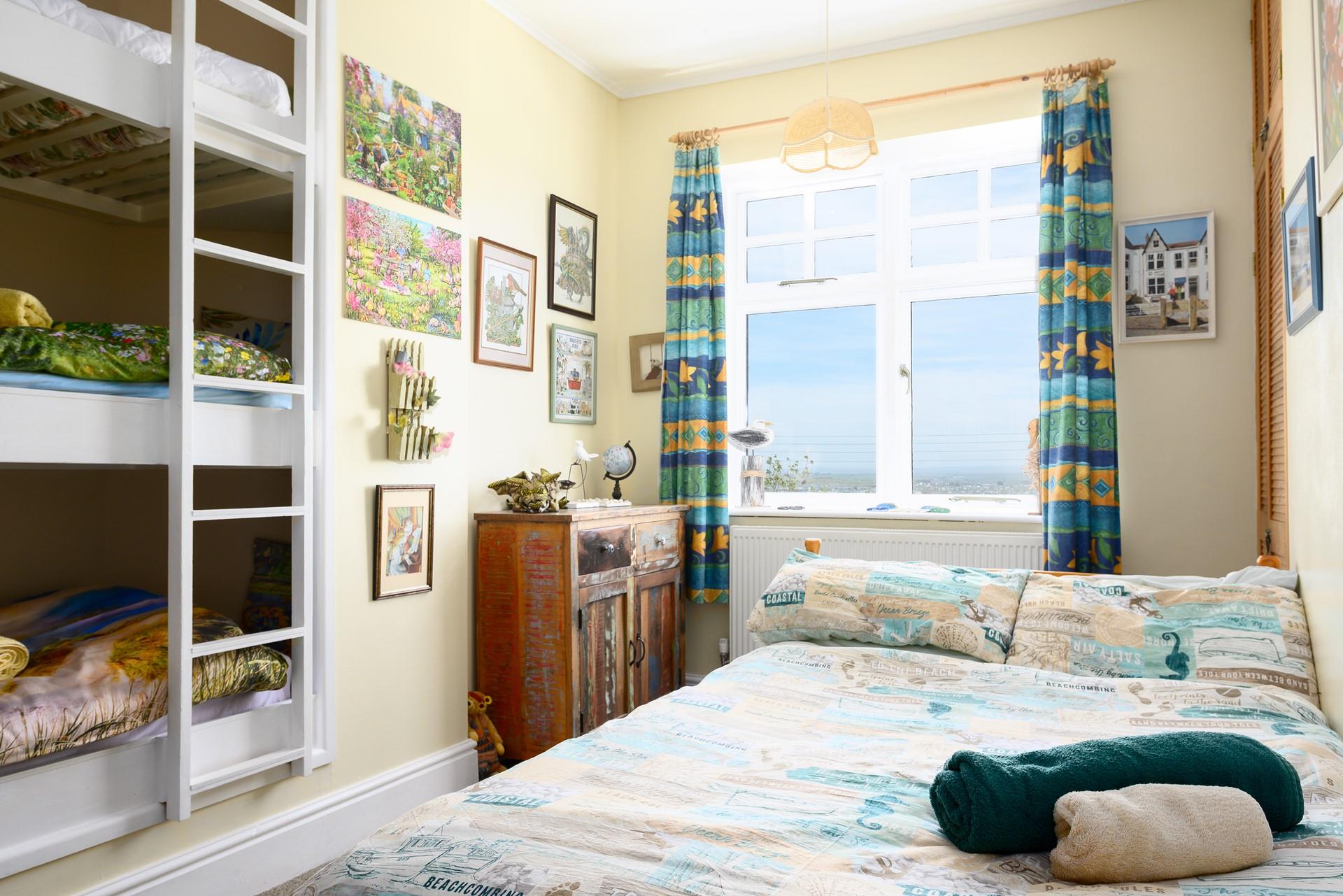 Kids will love these three bunk beds built into the wall!