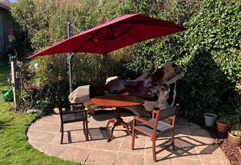 Pour yourself a glass of wine, grab a book and take a seat on the hand-crafted, one-of-a-kind bench in the garden. 