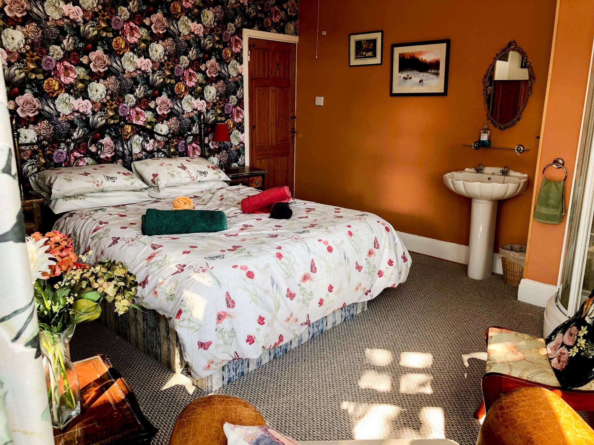 Bedroom 3 is light and spacious and benefits from a corner shower in the room. 