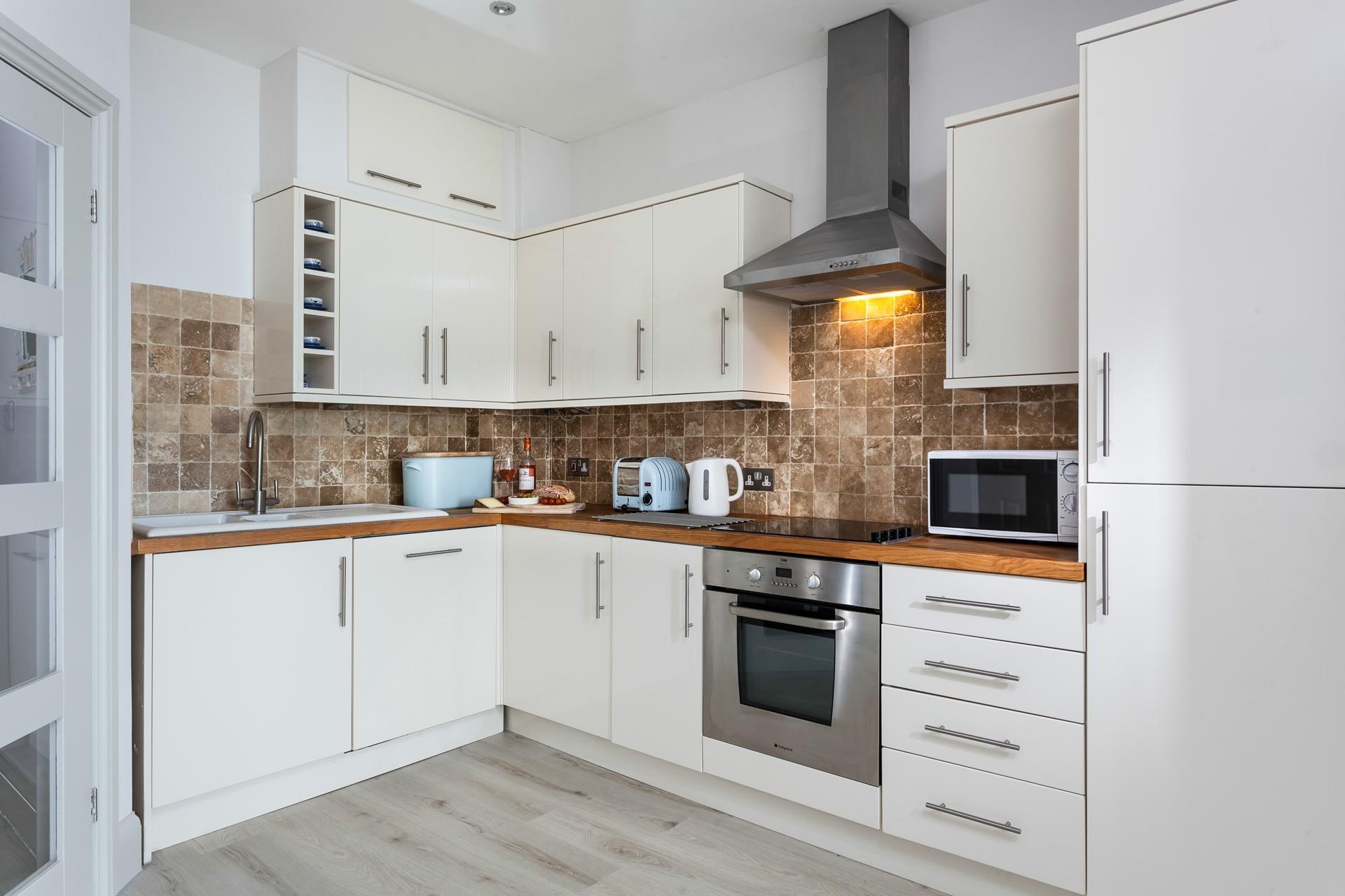 Enjoy socialising with your friends and family while prepping dinner in the open plan kitchen. 