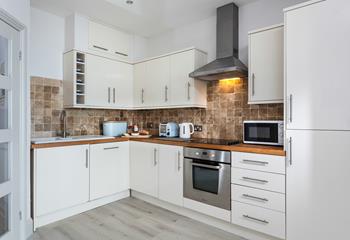 Enjoy socialising with your friends and family while prepping dinner in the open plan kitchen. 