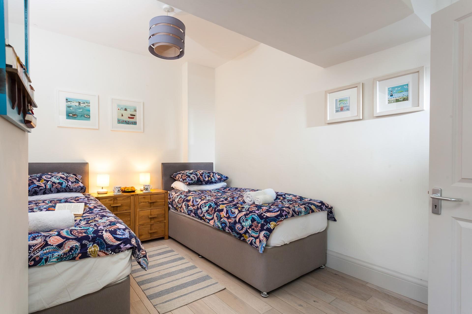 The twin beds provide the perfect base to rest your head at night.