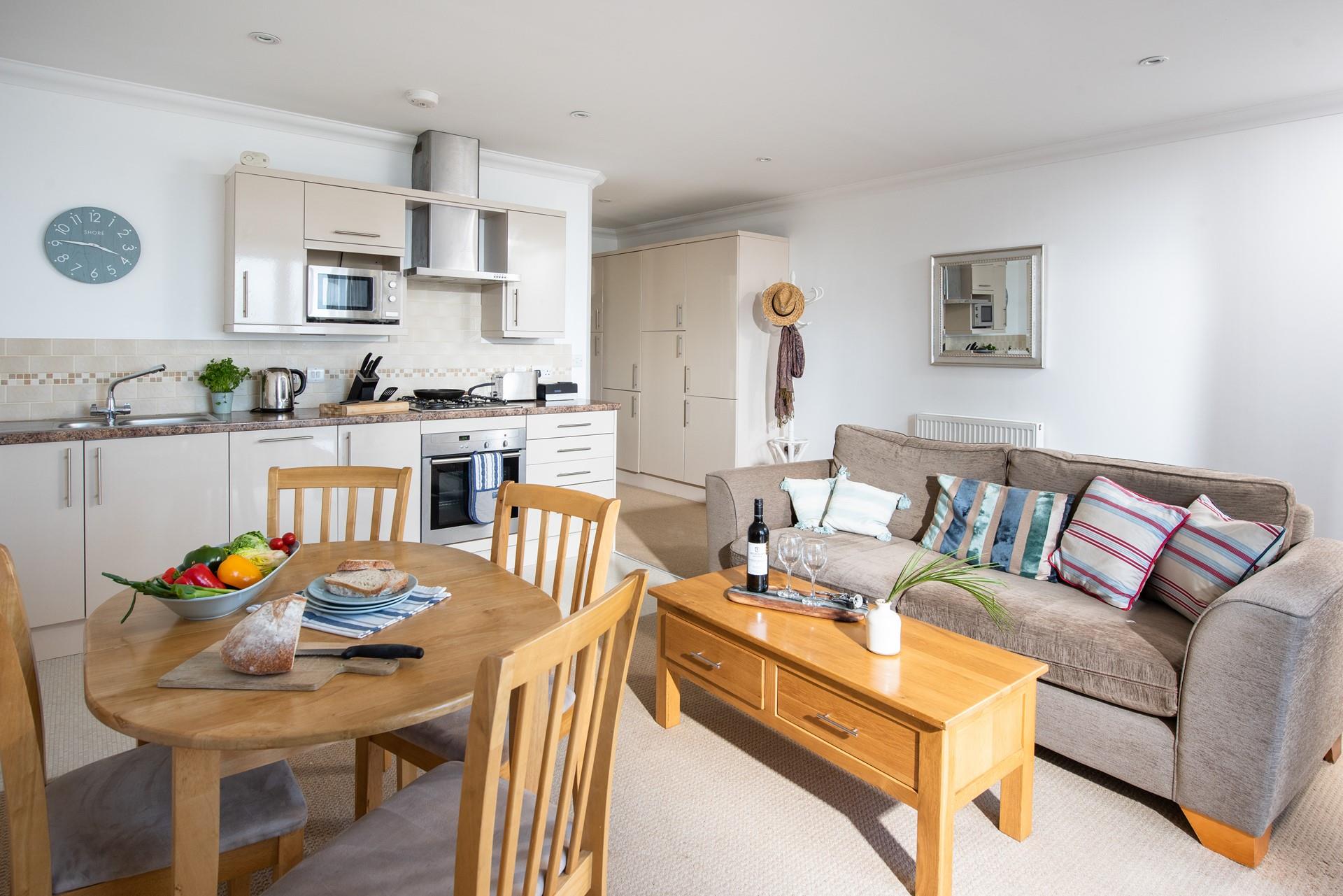 Enjoy a hearty lunch on the solid wood dining table for four.