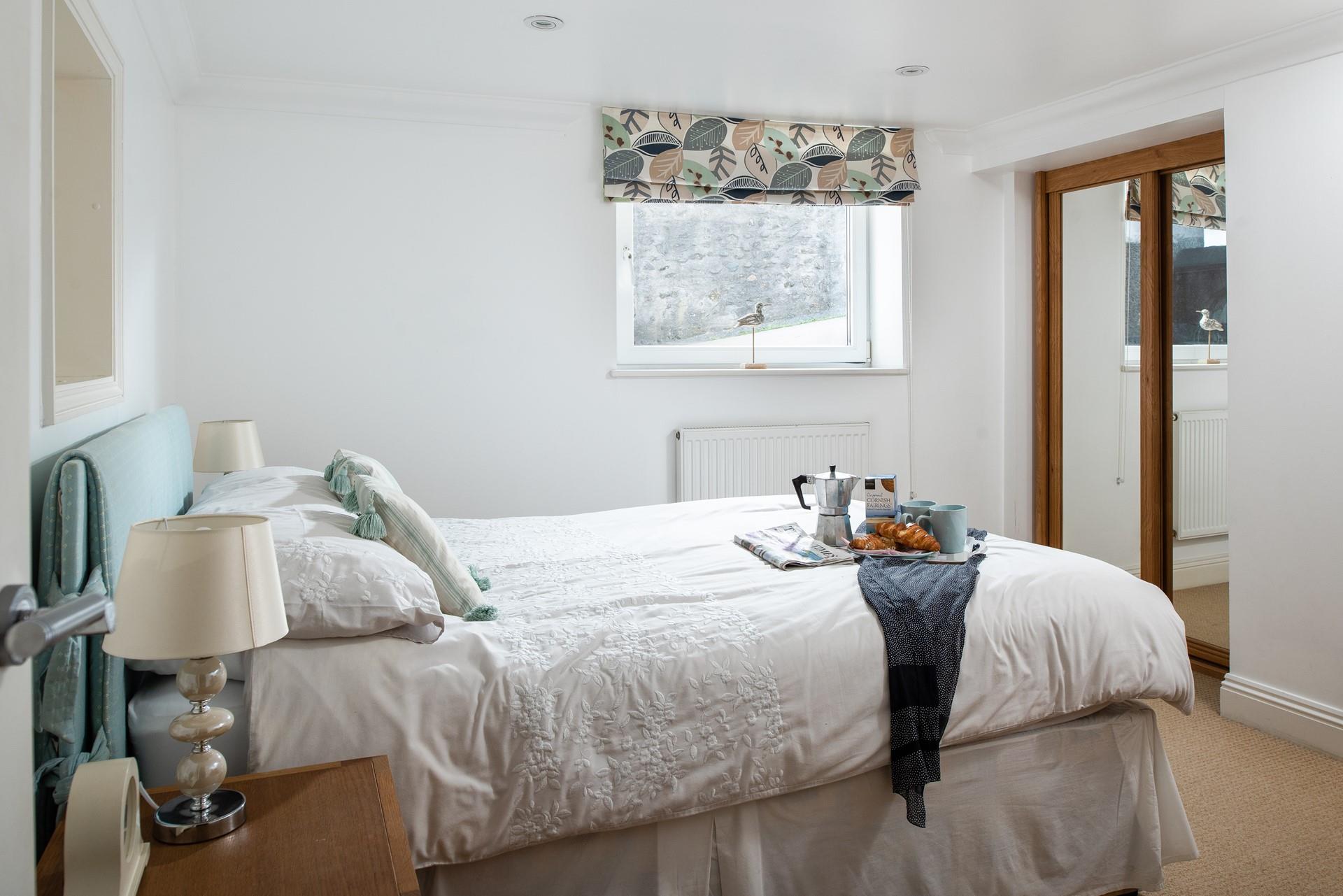 Bedroom 1 is spacious with full-length mirrors to help you choose the perfect outfit for the day.