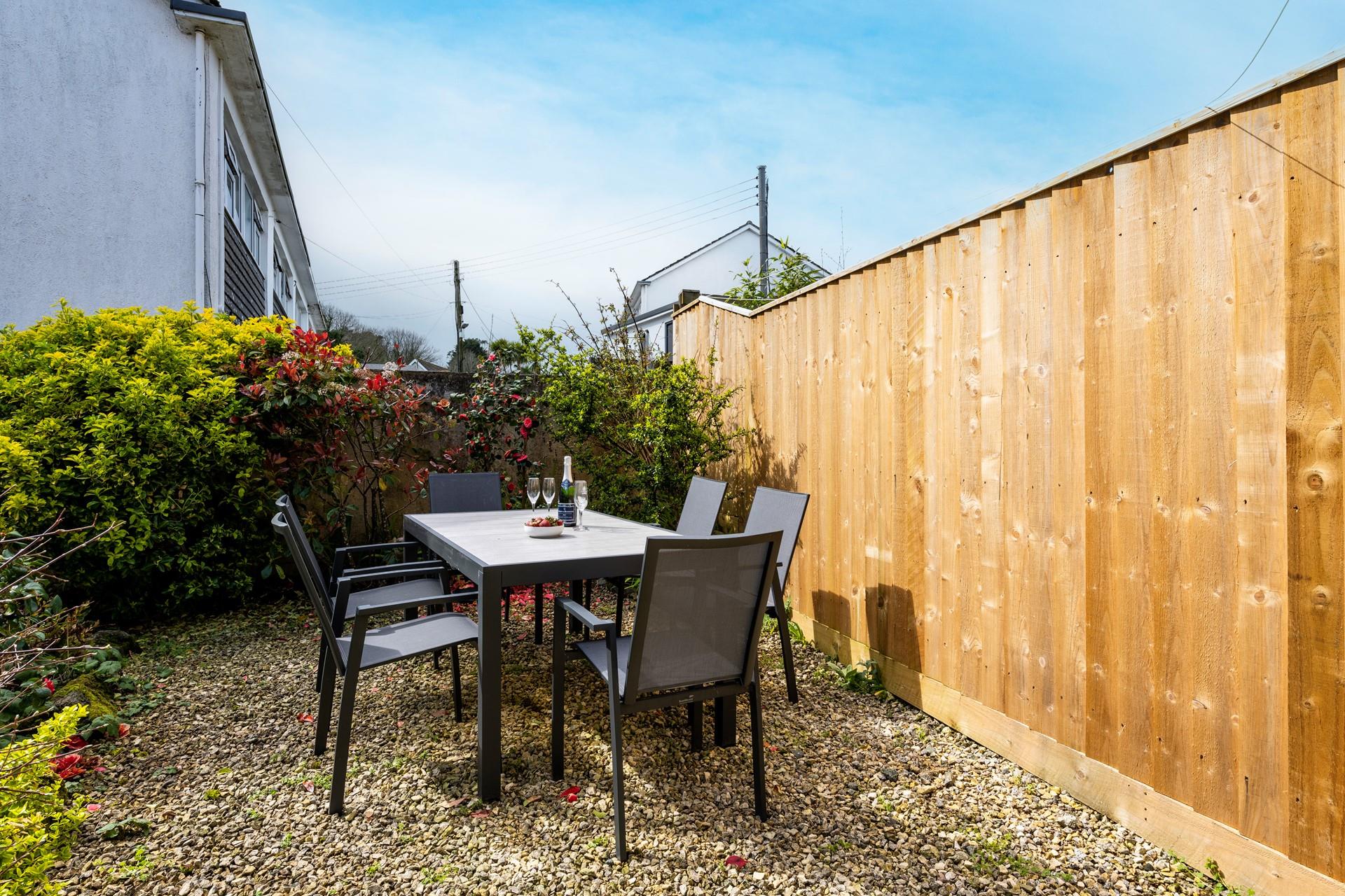 Loscombe garden borders are well established with lush shrubs and mature trees.