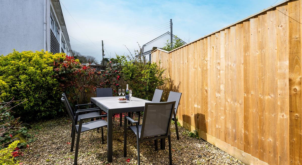 Loscombe garden borders are well established with lush shrubs and mature trees.