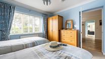 The twin beds are perfect for children or adults to drift into a dreamy slumber.