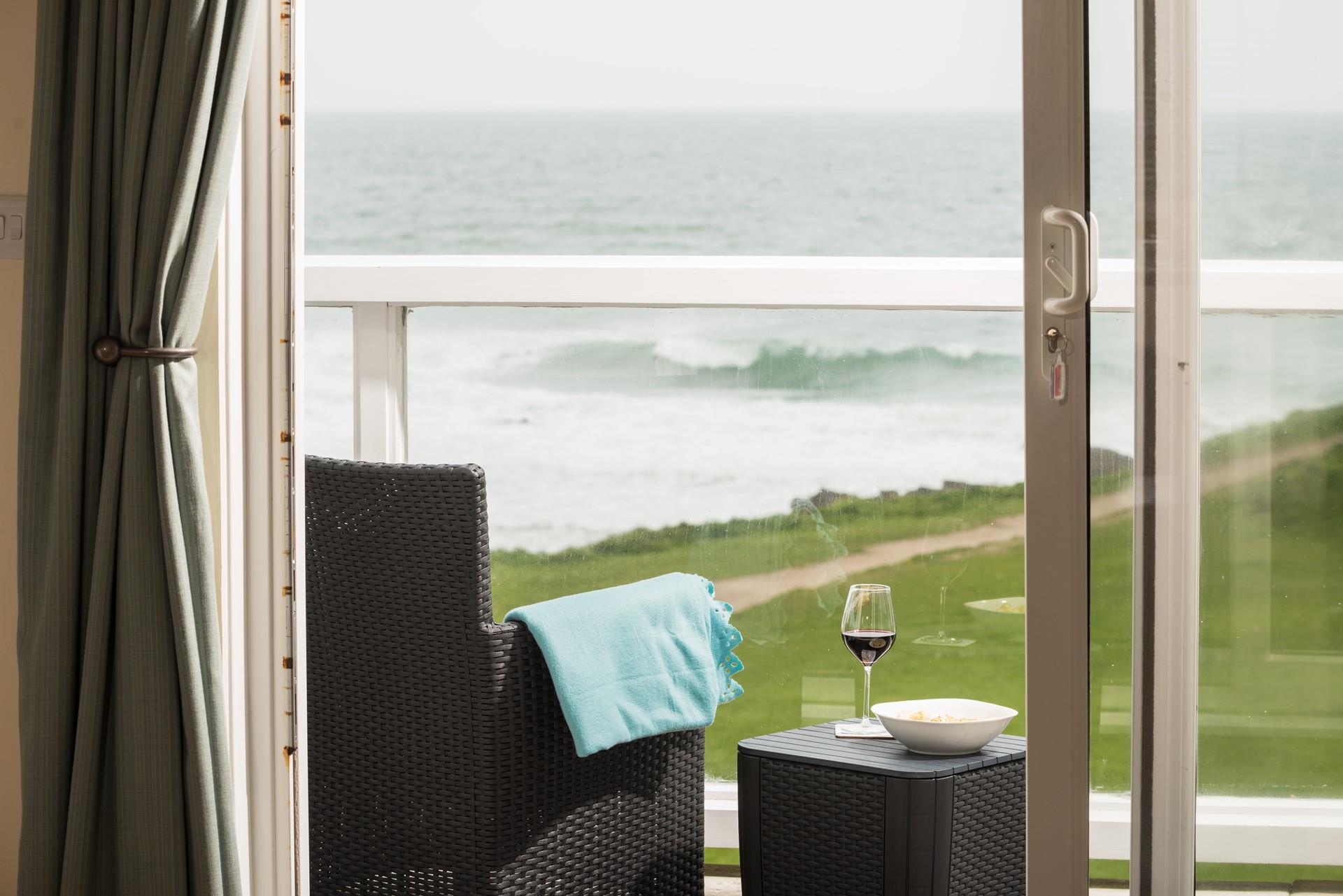 Spend hours relaxing on your balcony looking out to sea.