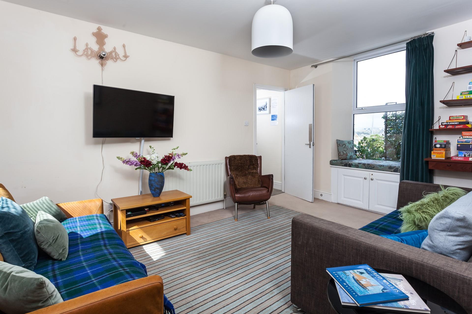 The sitting room is the perfect space to relax after spending your days exploring Cornwall.