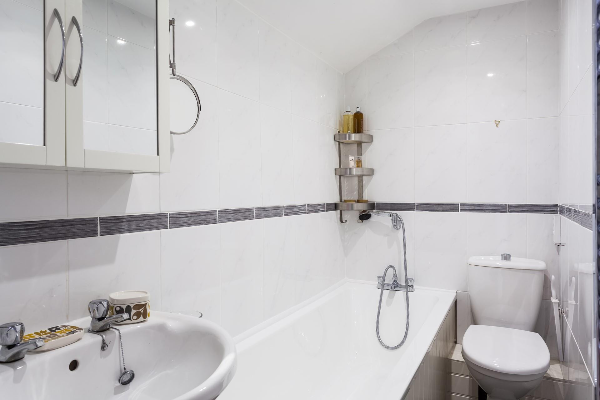 The contemporary bathroom, is located on the middle floor. 