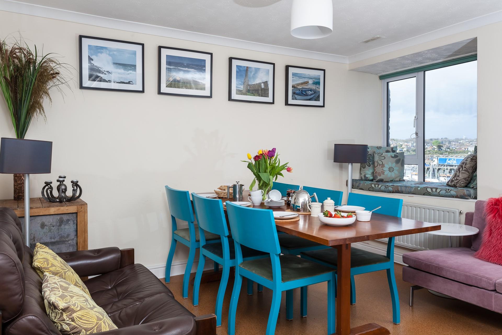 The window in the dining area overlooks the working harbour. 