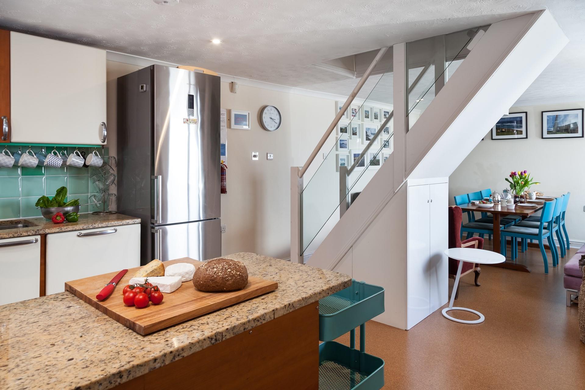 The middle floor is an open plan kitchen/dining area, the perfect space for cooking.