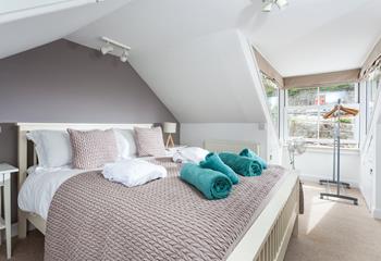 Bright and airy, this bedroom is located on the top floor.