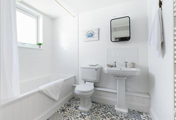 The family bathroom is on the first floor and features a bath with a shower over, ideal for washing away the sand after a day on the beach!