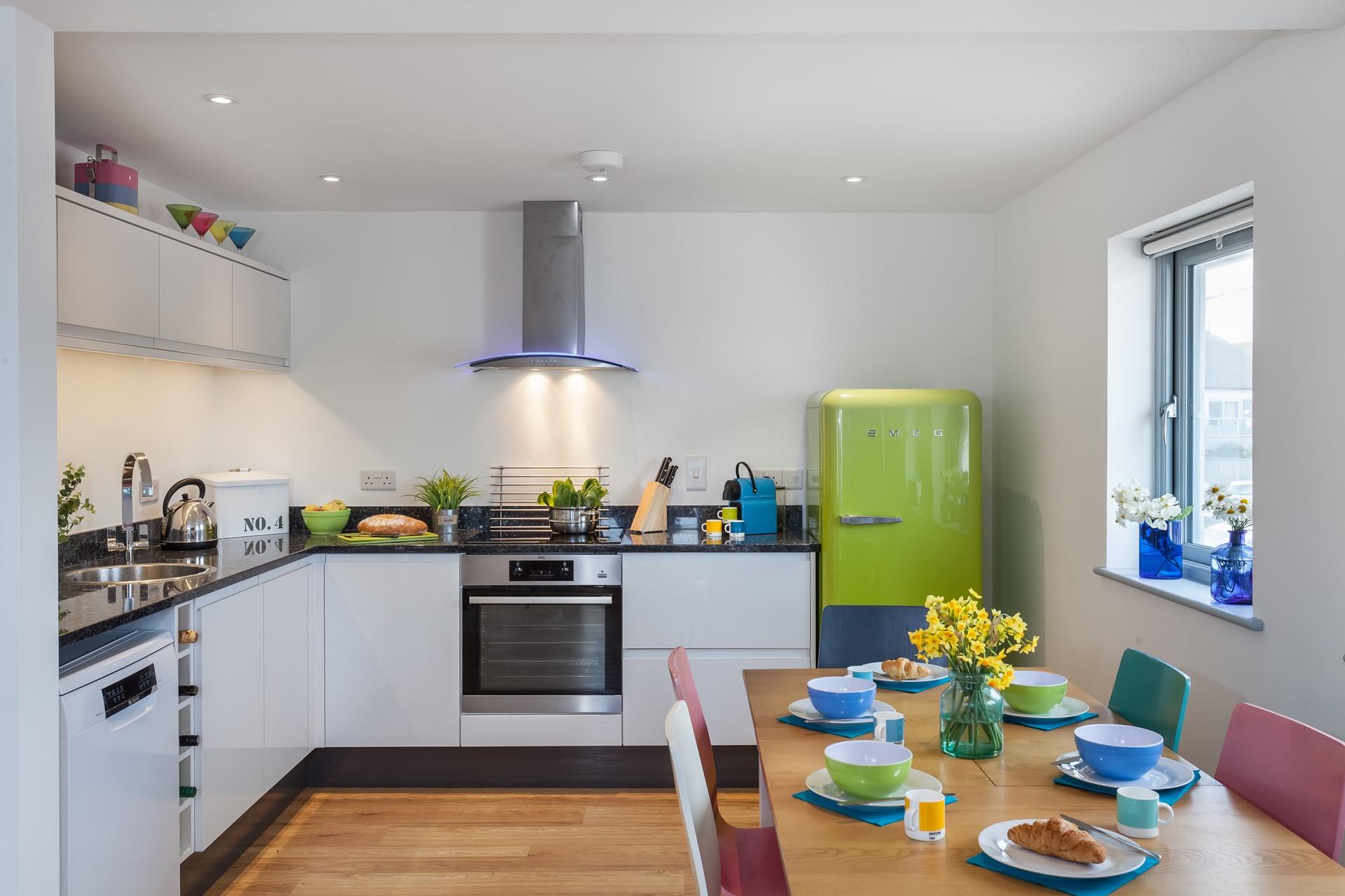 The well-equipped kitchen is bright and provides space for the chef of the family to cook up a storm.