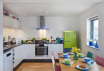 The well-equipped kitchen is bright and provides space for the chef of the family to cook up a storm.