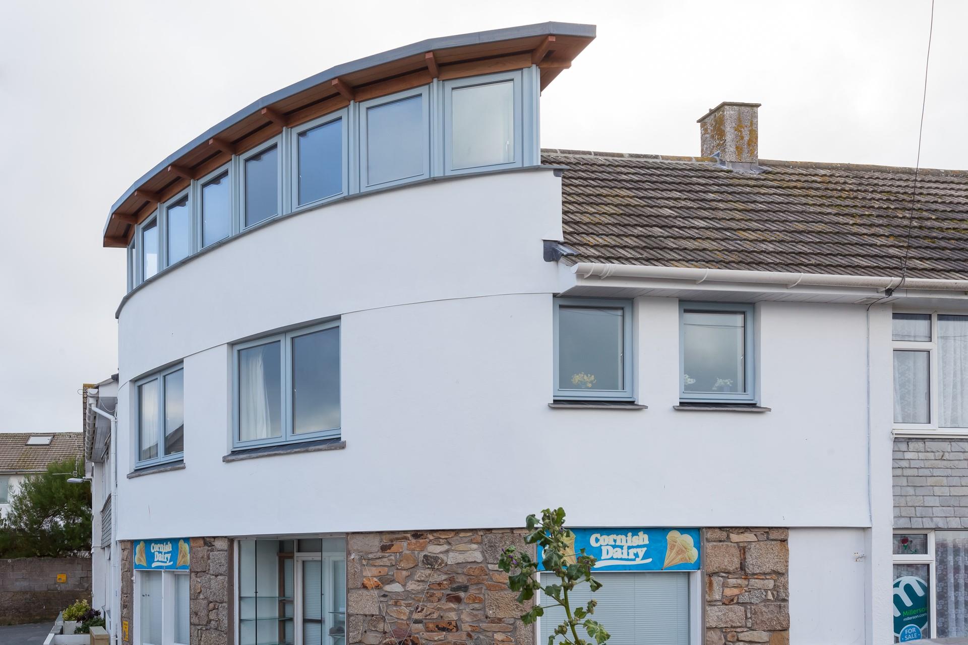 The outside of Number Four Beach Court with its feature windows. An amazing property! 