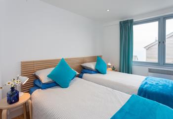 Bedroom 1 is located on the first floor and features twin beds, wake up to views of Porthgwidden.