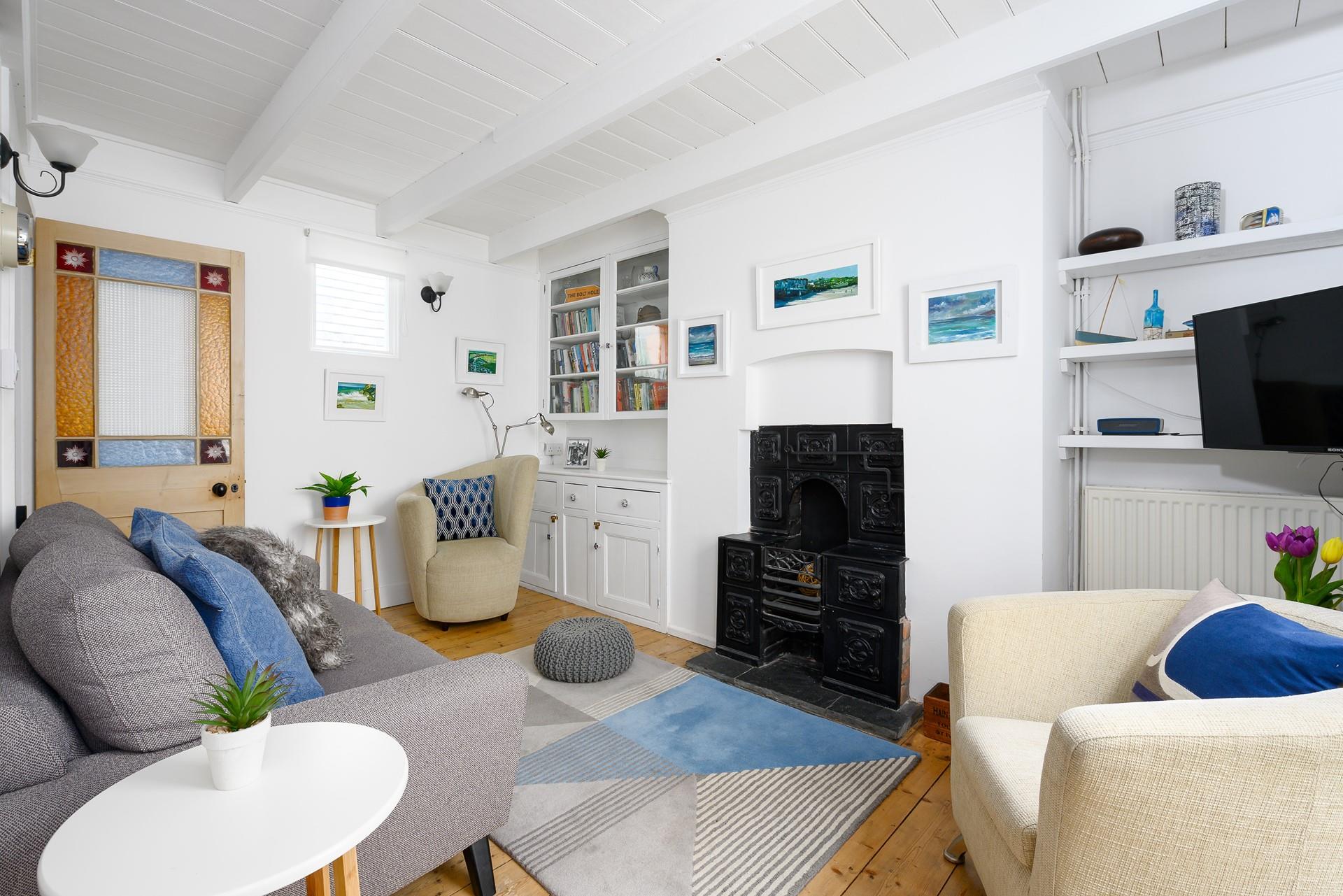 Space to unwind in the comfortable living area while you enjoy the modern oil paintings from local artists.