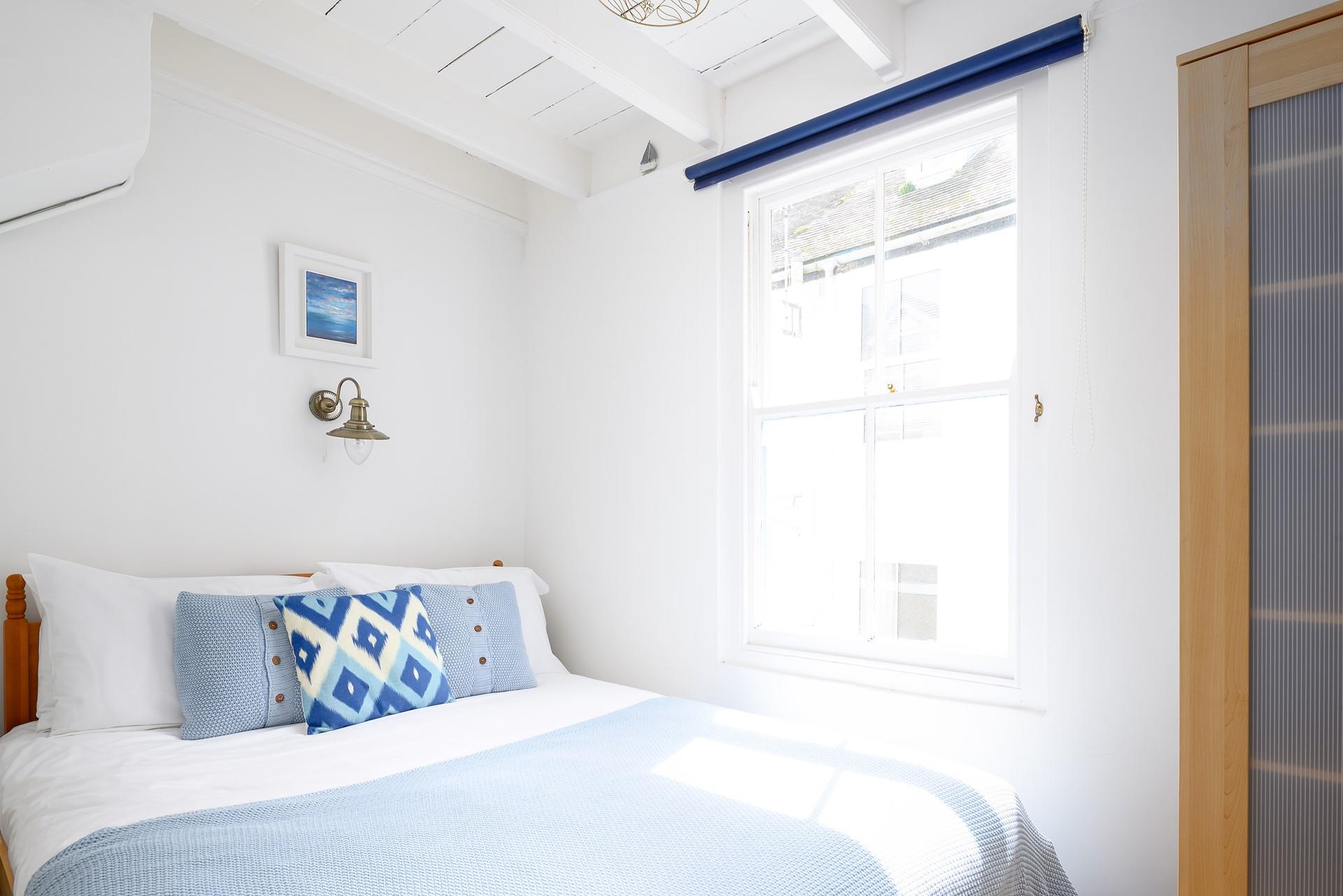 Let the sunshine into your light and airy bedroom with the blue and white theme giving you a relaxed and calm feeling.