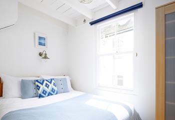 Let the sunshine into your light and airy bedroom with the blue and white theme giving you a relaxed and calm feeling.