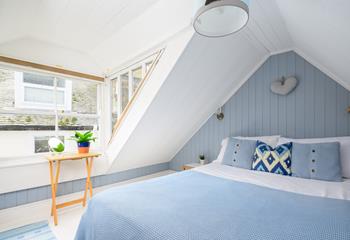 Serene and calming blue bedroom in the eaves to bring the sea to you.