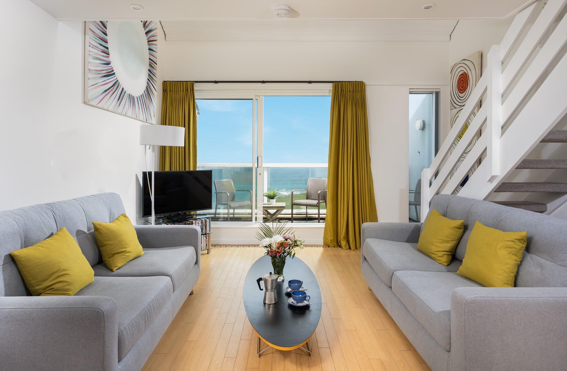 Sip your morning coffee on the balcony looking out at the waves rolling onto the beach.