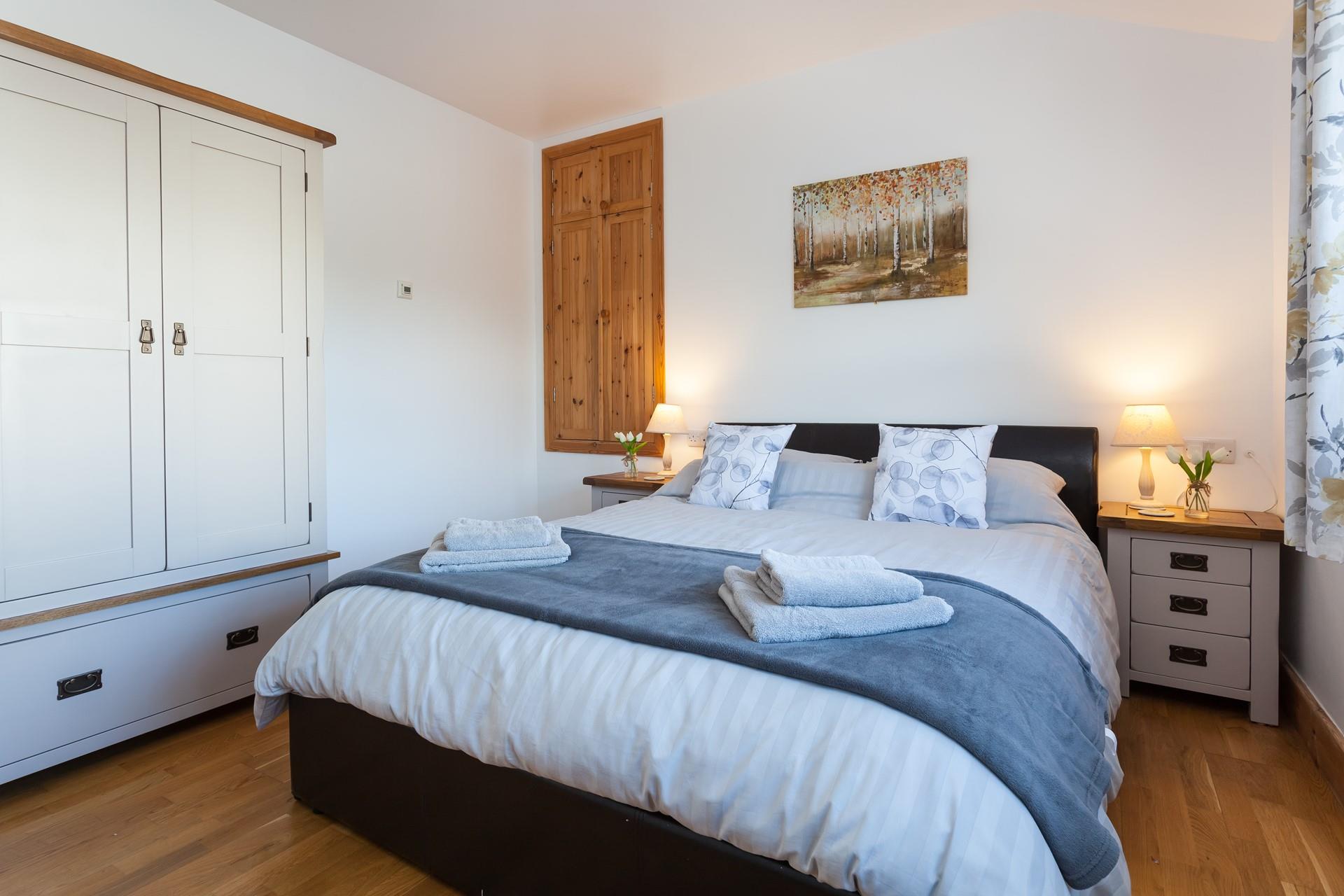 The gorgeous bedroom is wonderfully spacious, offering ample room for your holiday attire.