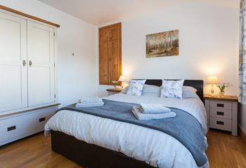The gorgeous bedroom is wonderfully spacious, offering ample room for your holiday attire.