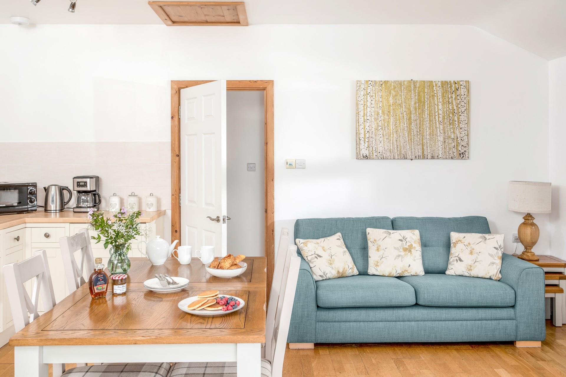 Classic furniture and country cottage tones give the sitting room a warm and welcoming feel.