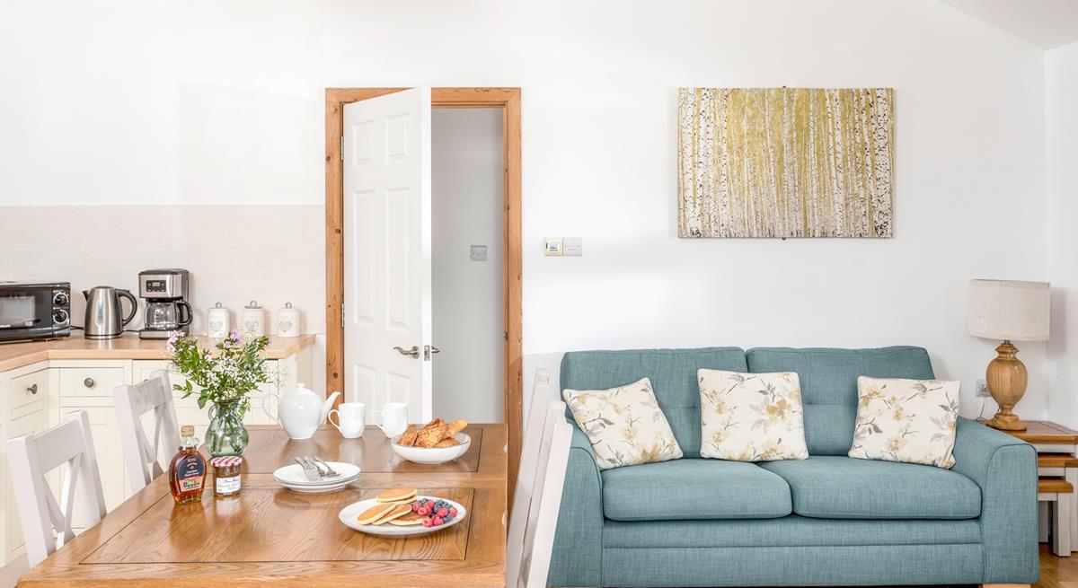 Classic furniture and country cottage tones give the sitting room a warm and welcoming feel.