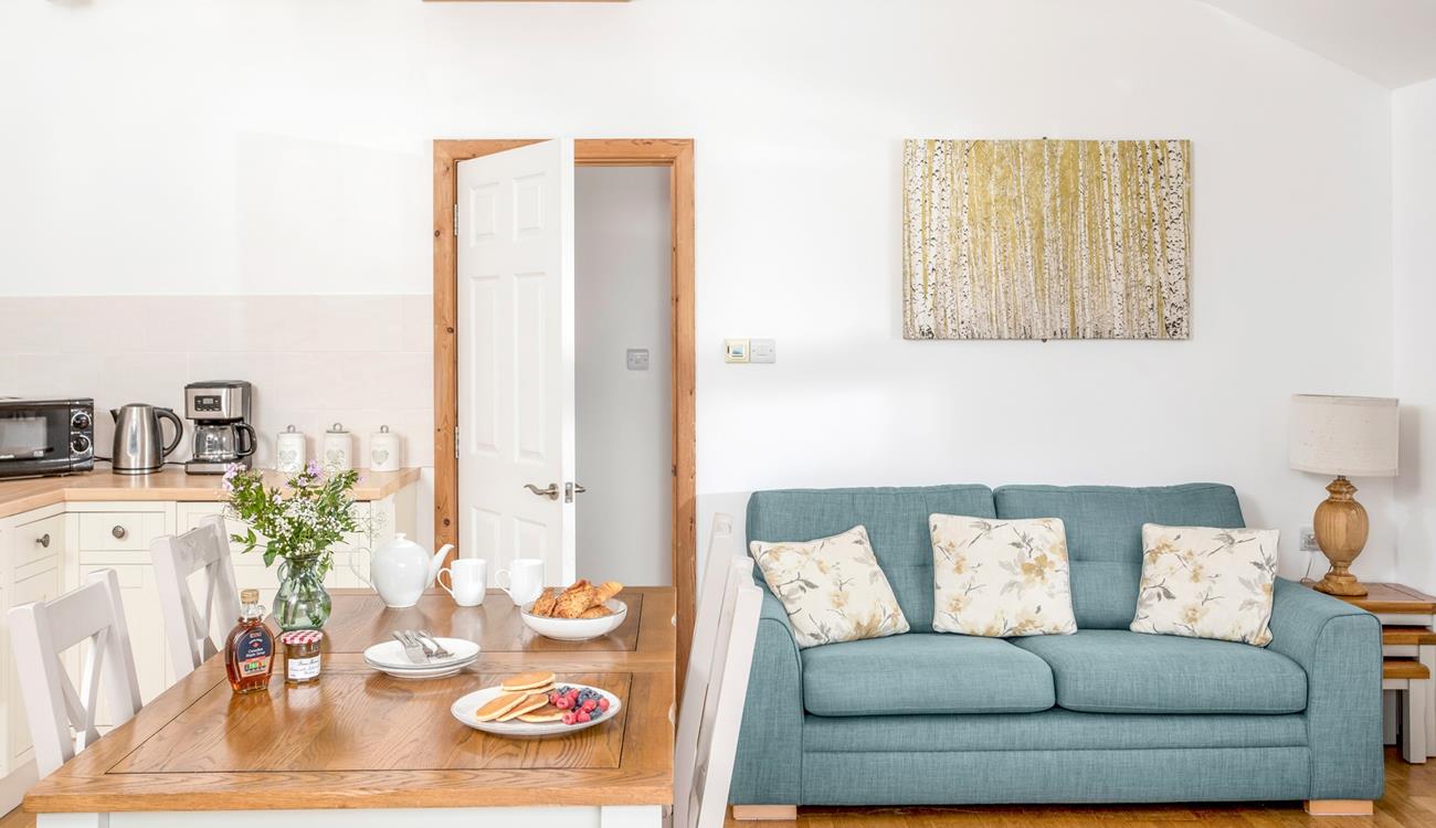 Classic furniture and country cottage tones give the sitting room a warm and welcoming feel.