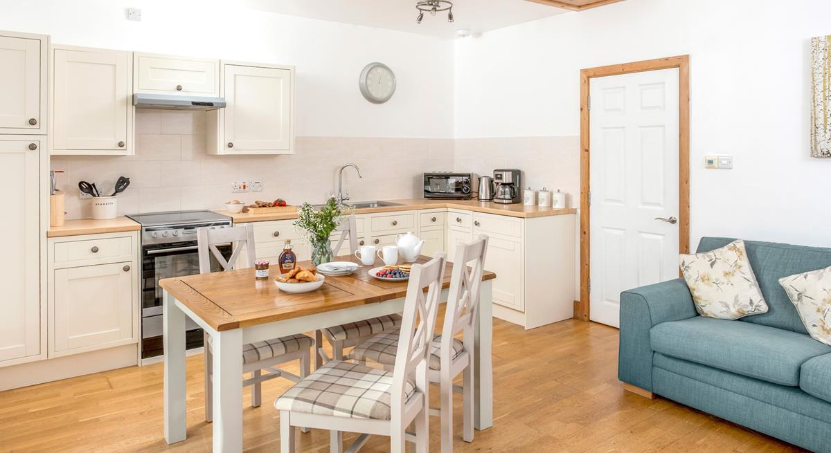 The dining area offers ample space to enjoy delicious home-cooked meals.