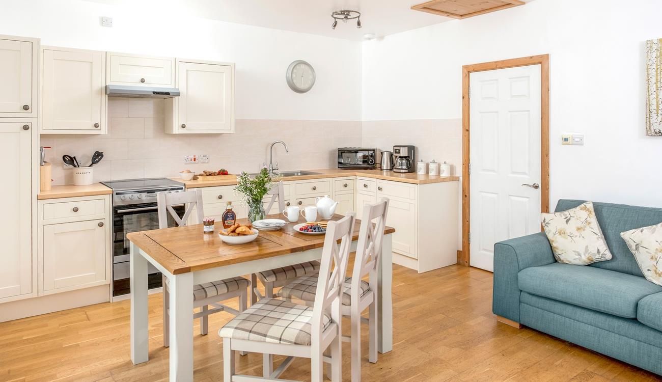 The dining area offers ample space to enjoy delicious home-cooked meals.