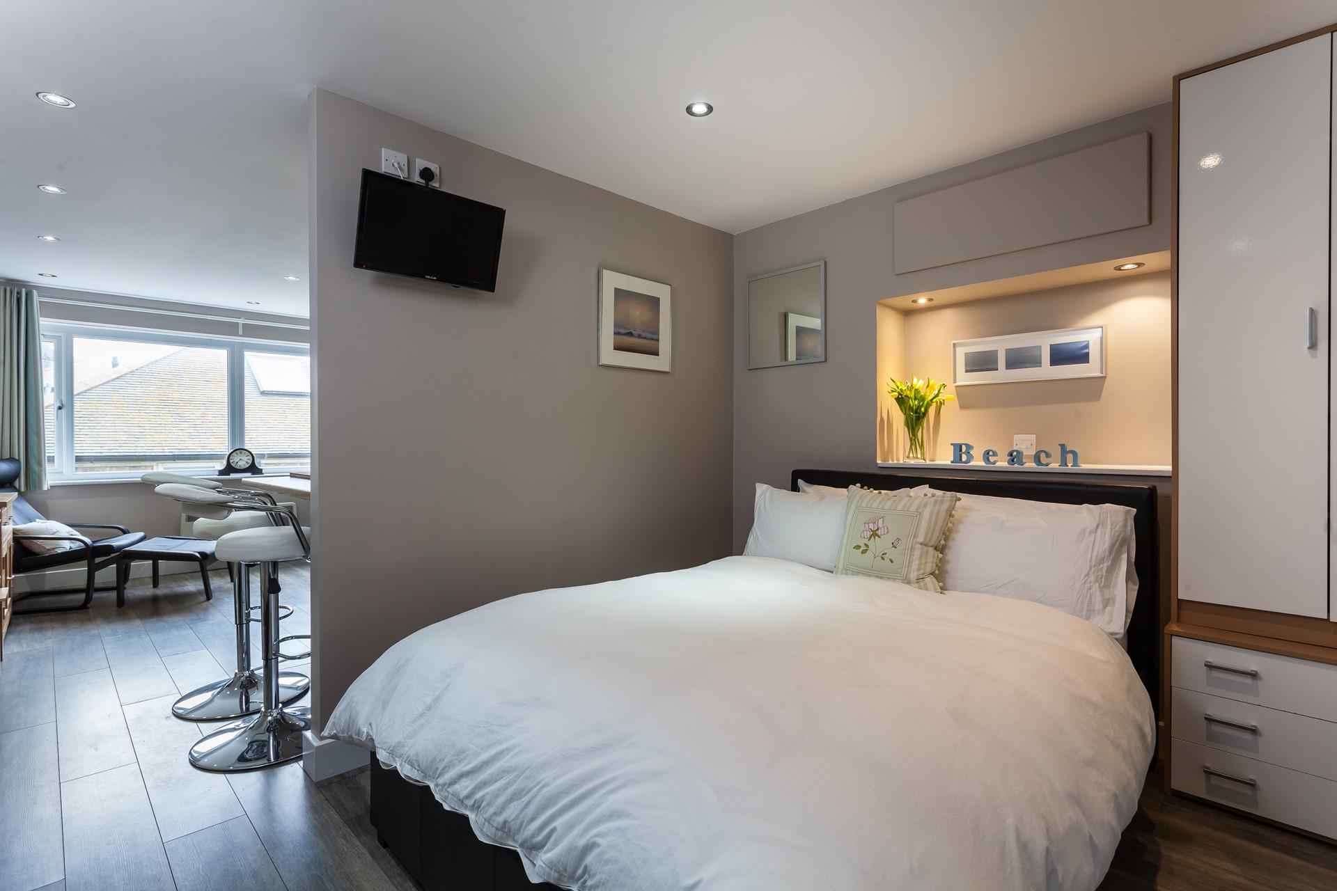 Climb into the soft sheets and drift off after a memorable day on the beach.