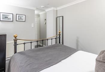 The king size bed offers a relaxing night's sleep.