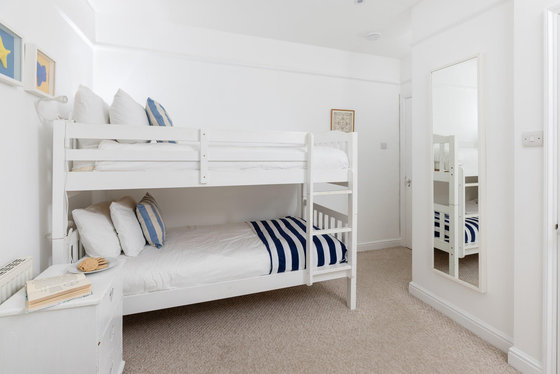 Settle the kids into the bunk beds and head out to the balcony for a cocktail in the evening sun.