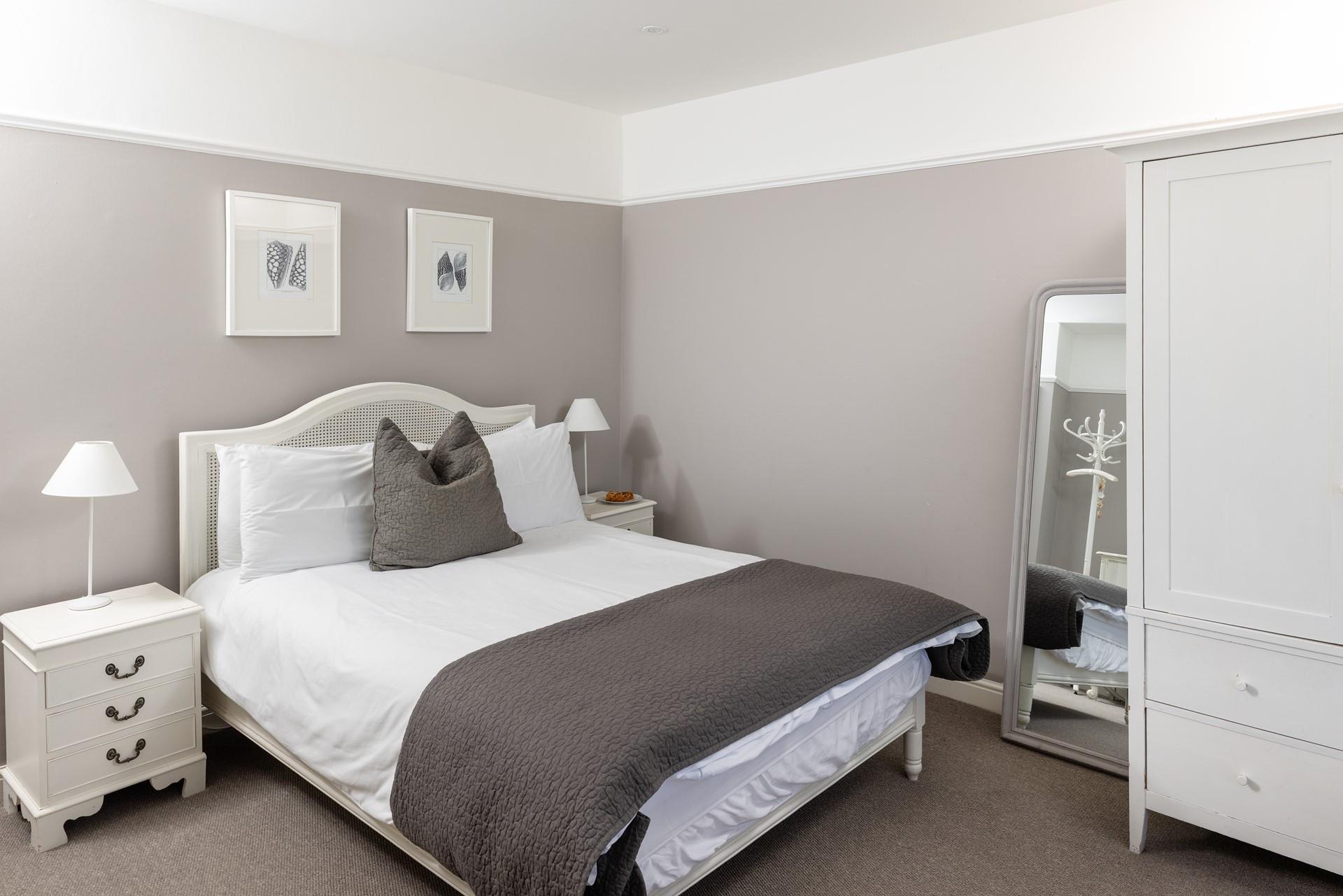 The bedrooms are decorated with calming neutral tones.