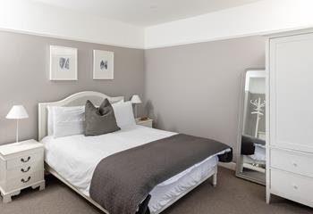 The bedrooms are decorated with calming neutral tones.