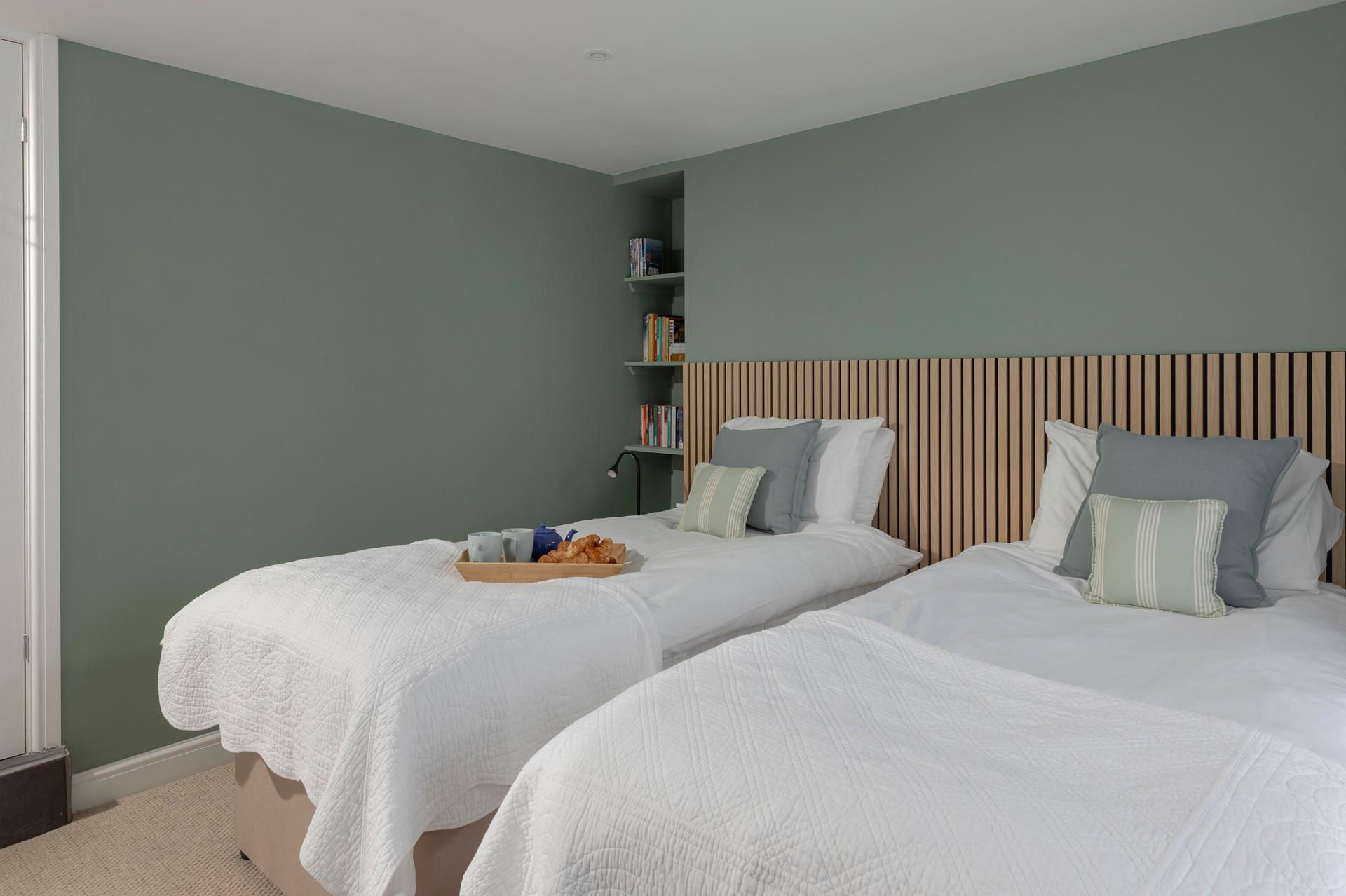 The lower ground floor has twin beds for additional guests.