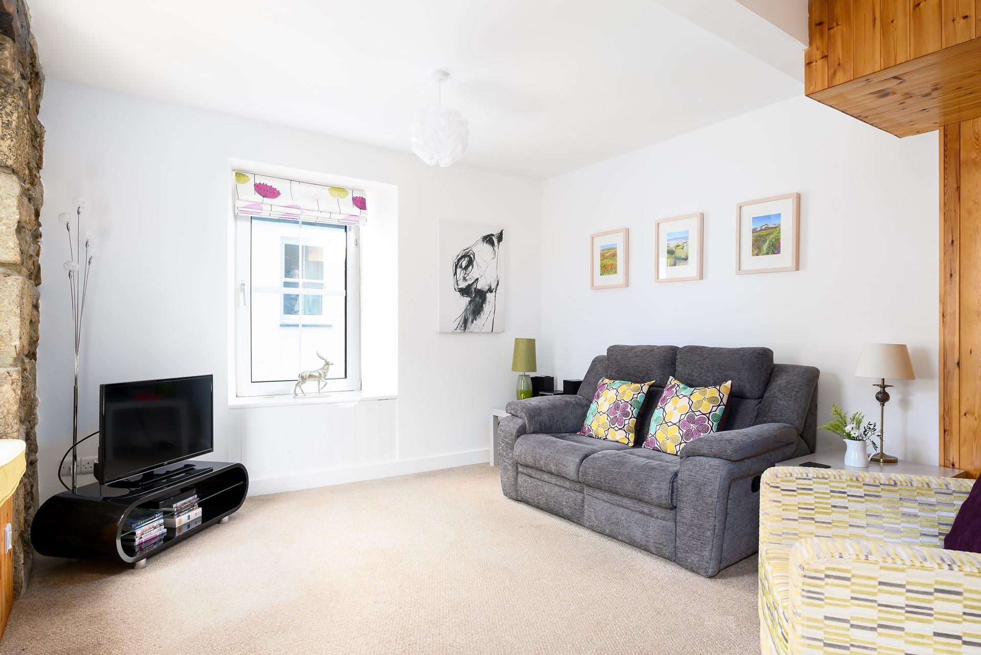 Cute countryside decor and soft natural tones have created a comforting rural cottage feel.