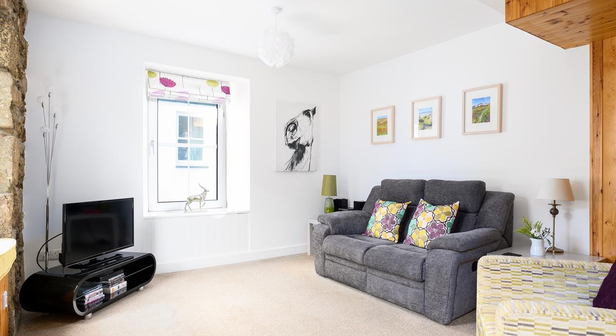 Cute countryside decor and soft natural tones have created a comforting rural cottage feel.