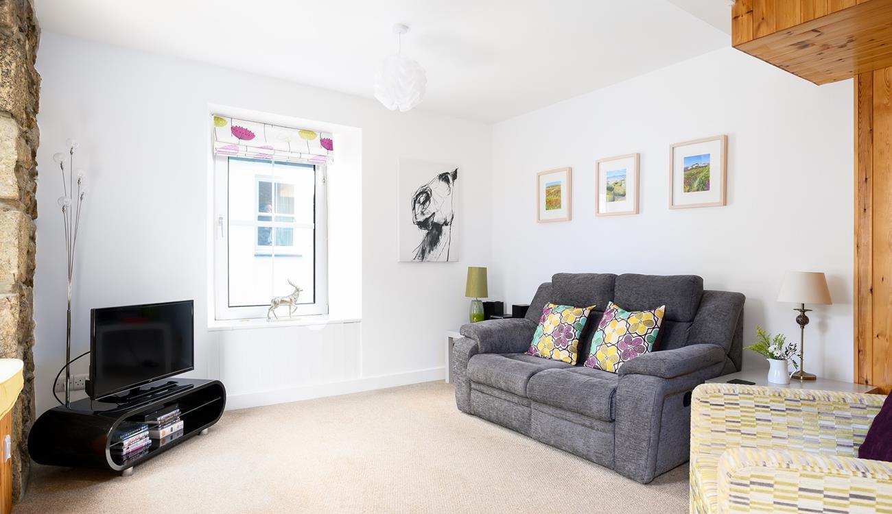 Cute countryside decor and soft natural tones have created a comforting rural cottage feel.