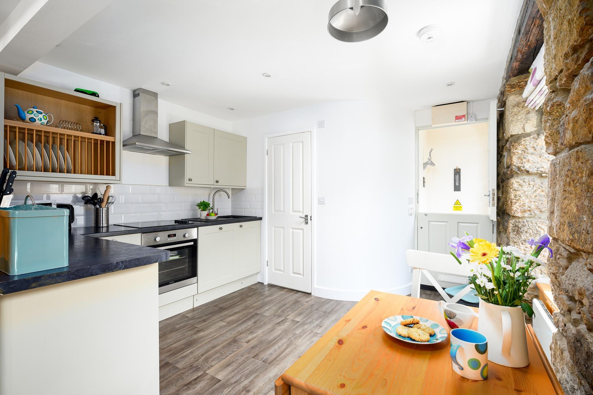 The kitchen table can be folded out, creating more room to enjoy meals together.