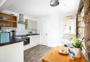 The kitchen table can be folded out, creating more room to enjoy meals together.