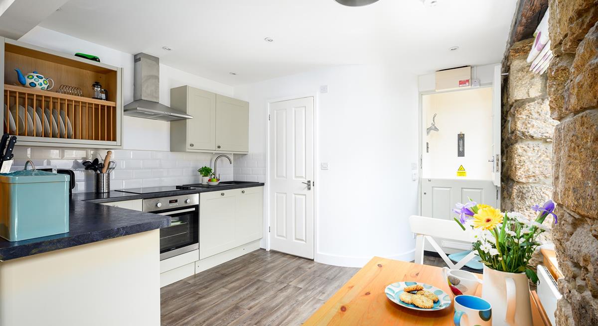 The kitchen table can be folded out, creating more room to enjoy meals together.