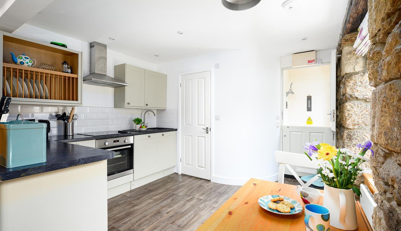 The kitchen table can be folded out, creating more room to enjoy meals together.