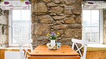 Enjoy a cream tea with lashings of Cornish clotted cream.